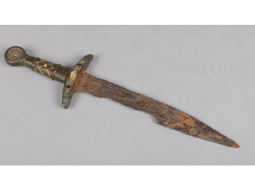A European medieval dagger with bronze h