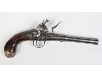 A Queen Anne flintlock pistol.