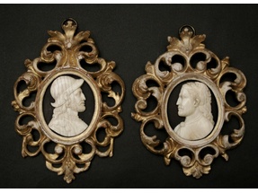 Two carved ivory portraits.