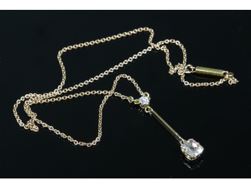 A 15ct gold drop pendant set with two di