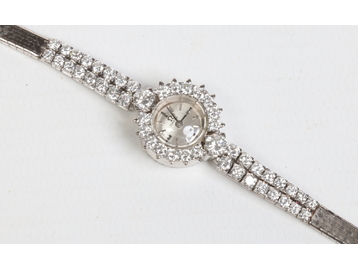 A ladies Art Deco Omega white metal and 