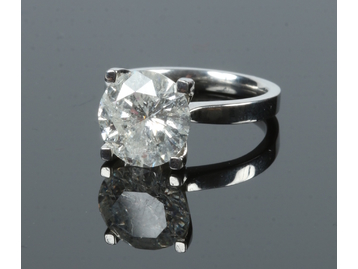 A platinum and diamond solitaire ring. W