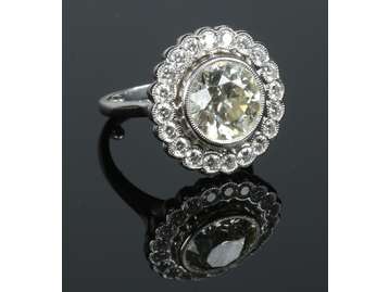 A platinum diamond set dress ring. The p