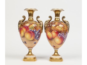 A pair of Royal Worcester urns.