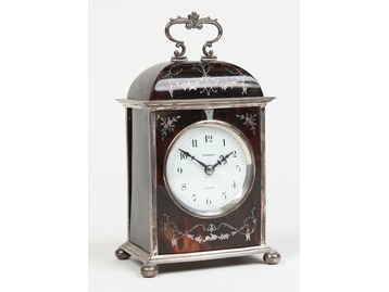 Silver and tortoiseshell clock.