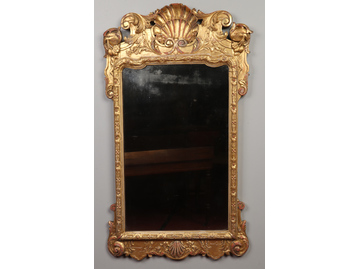 An antique Irish giltwood hall mirror. T