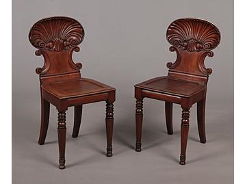A pair of Regency mahogany hall chairs. 