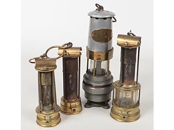 Four miners lamps. A Naylor of Wigan spi