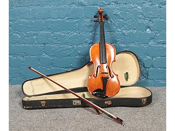 A cased violin, label for Alfred William