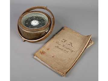 A nautical brass gimbal/compass along wi