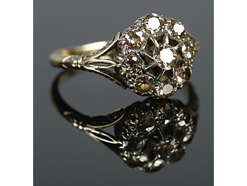 An 18ct gold diamond cluster ring. Appro
