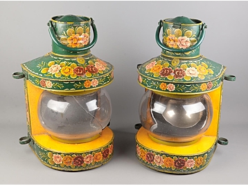 A pair of metal ships lamps with painted