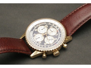An 18ct gold Breitling wristwatch.