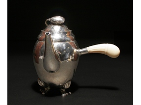 A Georg Jensen silver chocolate pot.