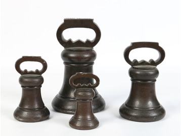 A set of bronze bell weights.