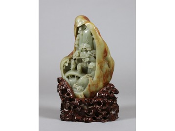A Chinese celadon jade boulder.