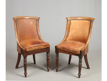 A pair of Regency mahogany leather uphol